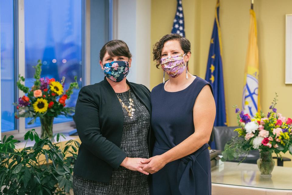 Anchorage Acting Mayor Austin Quinn-Davidson with her wife, Stephanie Quinn-Davidson, right, at the swearing-in ceremony on Friday, Oct. 23.