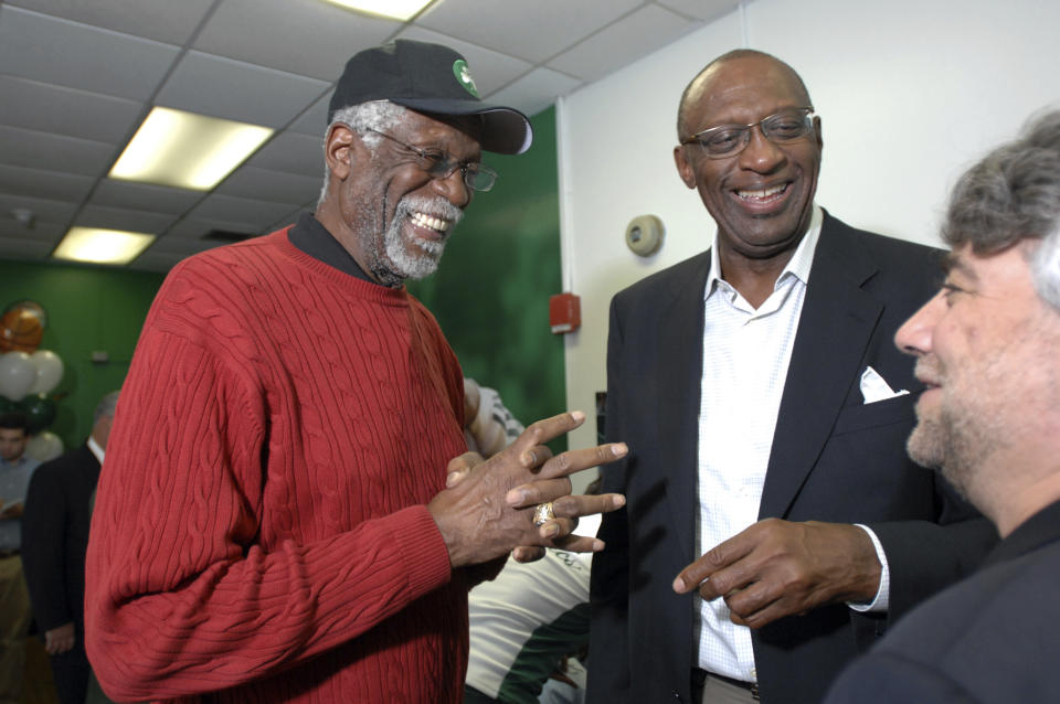 FILE -Former NBA players Bill Russell, left, and Bob Lanier share a laugh during the ceremonial opening of a new reading and learning center at a community center Friday, June 6, 2008, in Boston. Bob Lanier, the left-handed big man who muscled up beside the likes of Kareem Abdul-Jabbar as one of the NBA’s top players of the 1970s, died Tuesday, May 10, 2022. He was 73. (AP Photo/Josh Reynolds, File)