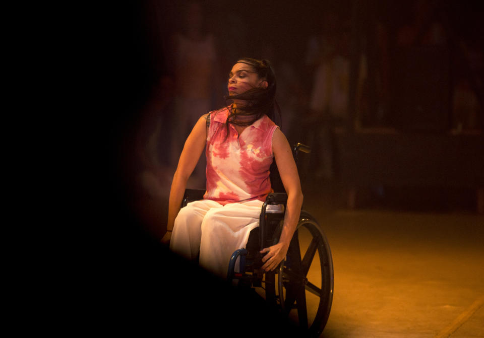 In this Dec. 4, 2018 photo, dancer Iraly Yanez performs in the contemporary dance production Ubuntu, at the Teresa Carreno Theater in Caracas, Venezuela. The ballerina was hit by a stray bullet on New Year's eve in 2010 as she entered her home in a crime-ridden slum. That was the end of her dancing until she joined AM Danza in September. (AP Photo/Fernando Llano)