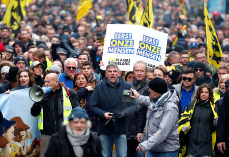 Flemish right-wing party President Filip Dewinter attends a protest against Marrakesh Migration Pact in Brussels, Belgium December 16, 2018. Banner reads "People first". REUTERS/Francois Lenoir