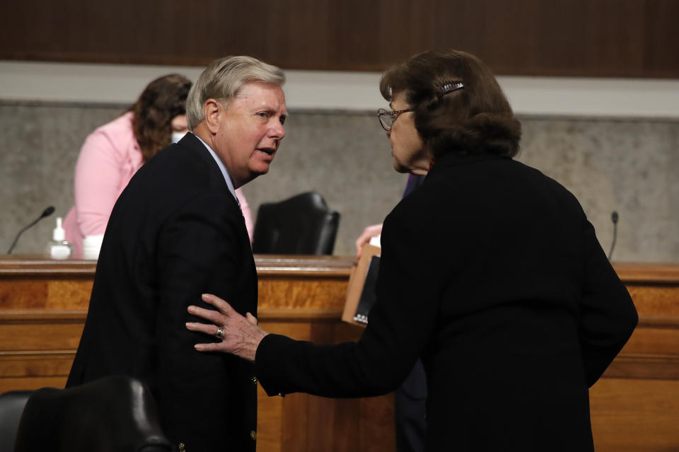 Chairman Lindsey Graham, R-S.C., talks with Sen. Dianne Feinstein, D-Calif., after a Senate Judiciary Committee business meeting to consider authorization for subpoenas relating to the Crossfire Hurricane investigation, and other matters on Capitol Hill in Washington, Thursday, June 11, 2020. (AP Photo/Carolyn Kaster, Pool)