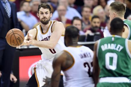 May 23, 2017; Cleveland, OH, USA; Cleveland Cavaliers forward Kevin Love (0) makes a pass during the second half against the Boston Celtics in game four of the Eastern conference finals of the NBA Playoffs at Quicken Loans Arena. Mandatory Credit: Ken Blaze-USA TODAY Sports