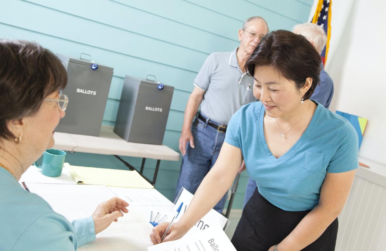 Asian American voter turnout increases when an Asian American is on the ballot. <a href="https://www.gettyimages.com/detail/photo/voters-registering-voting-in-the-november-united-royalty-free-image/589584900?phrase=asian%20american%20voters&adppopup=true" rel="nofollow noopener" target="_blank" data-ylk="slk:fstop123/Collection E+ via Getty Images;elm:context_link;itc:0;sec:content-canvas" class="link ">fstop123/Collection E+ via Getty Images</a>