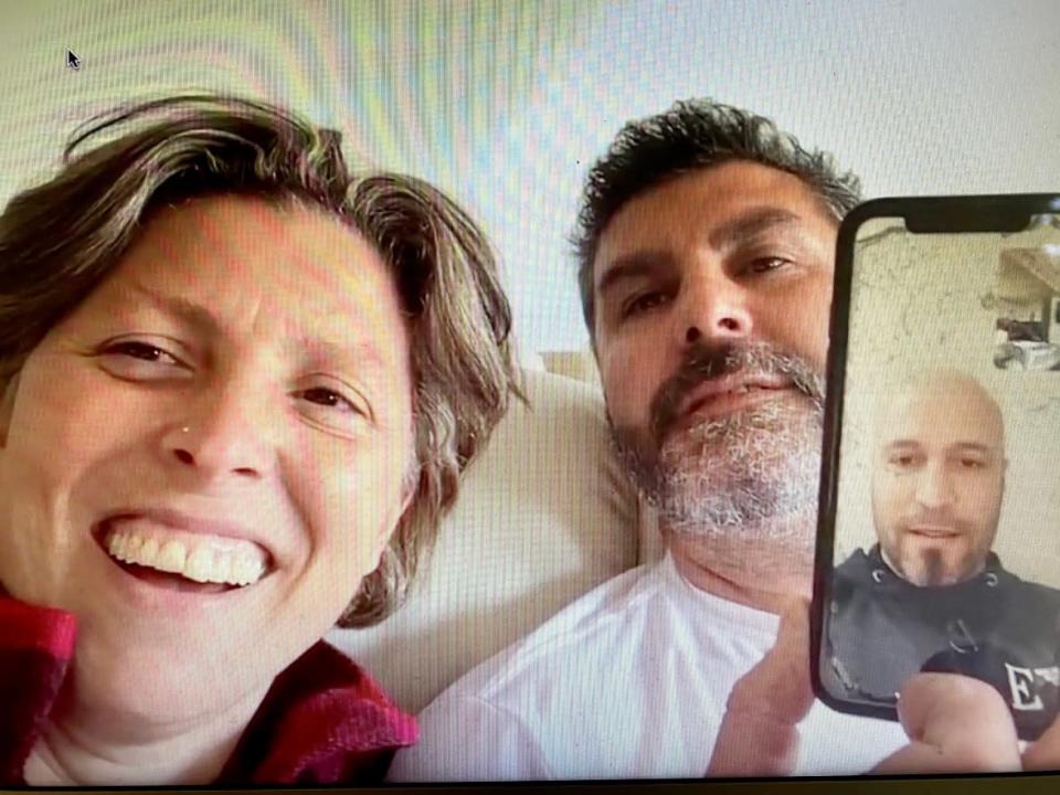 Roberta and Flaminio Ferrari hold a FaceTime conversation with their prospective employee Abdelkarim El Ayachi. Ayachi has been given a second chance at moving from Italy to Canada after a judge overturned an Immigration officer&#39;s rejection of his application for a work permit.  (Jason Proctor - image credit)