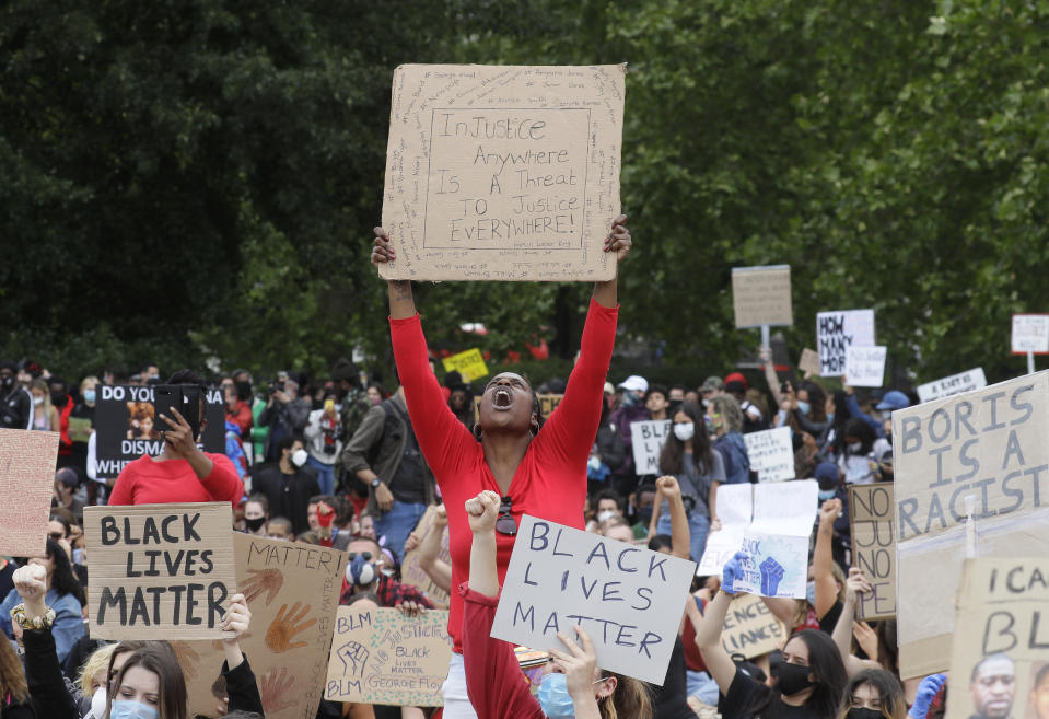 FILE - In this Wednesday, June 3, 2020 file photo protesters take part in a demonstration in Hyde Park, London, over the death of George Floyd, a black man who died after being restrained by Minneapolis police officers on May 25. (AP Photo/Kirsty Wigglesworth, File)