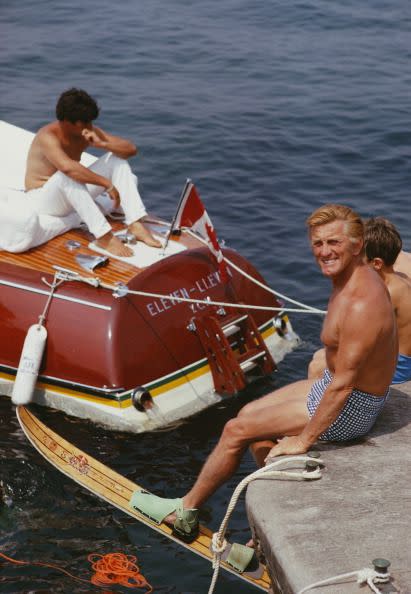 <p>Kirk Douglas smiles at the camera as he prepares for an afternoon of waterskiing in Antibes, France in 1969. </p>