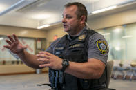 Sgt. Matt Gilmore gestures as he talks about using Axon's Draft One AI software during an interview at Oklahoma City police headquarters on Friday, May 31, 2024 in Oklahoma City, Oklahoma. (AP Photo/Nick Oxford)