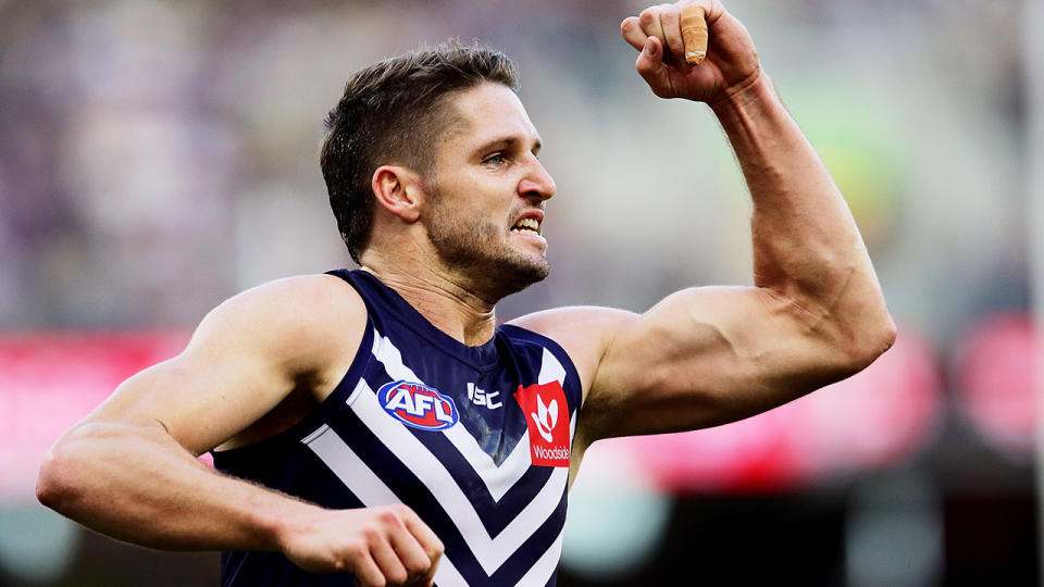 Pictured here, Jesse Hogan celebrates during a game for Fremantle in the AFL.