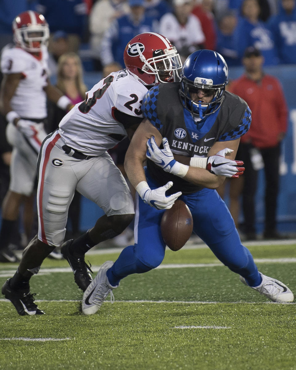 Georgia defensive back Mark Webb (23) breaks up a pass to Kentucky tight end C.J. Conrad (87) during the second half an NCAA college football game in Lexington, Ky., Saturday, Nov. 3, 2018. (AP Photo/Bryan Woolston)