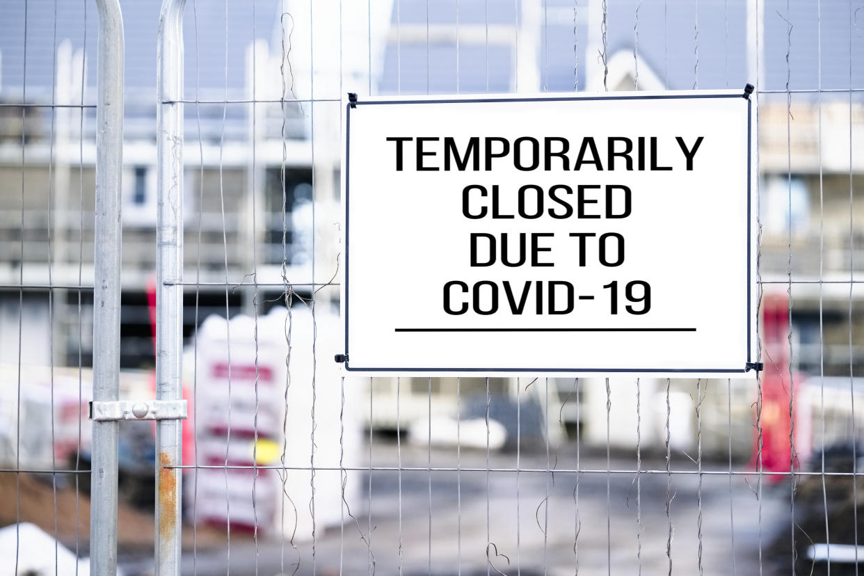 Closed building site sign due to Coronavirus Covid-19 uk