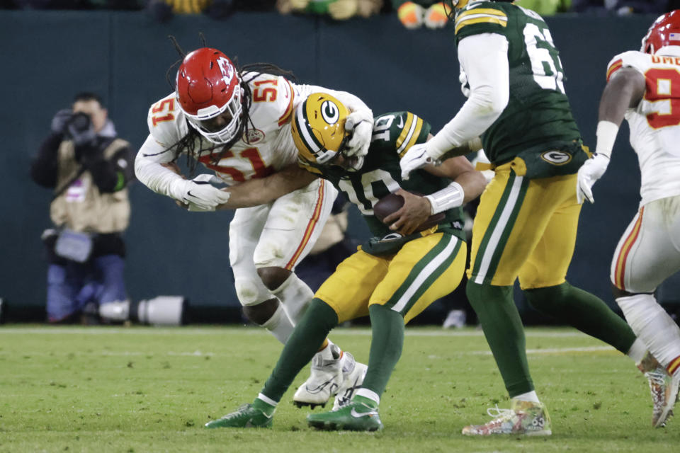 Kansas City Chiefs defensive end Mike Danna (51) sacks Green Bay Packers quarterback Jordan Love (10) during the second half of an NFL football game Sunday, Dec. 3, 2023 in Green Bay, Wis. (AP Photo/Mike Roemer)