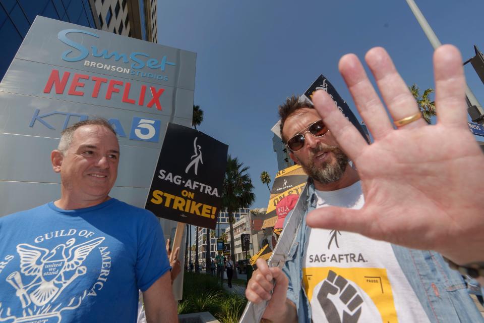 Actor Noah Wyle on the picket line outside Netflix studios in September. The actors' union has reached a deal to end the strike that began July 14.