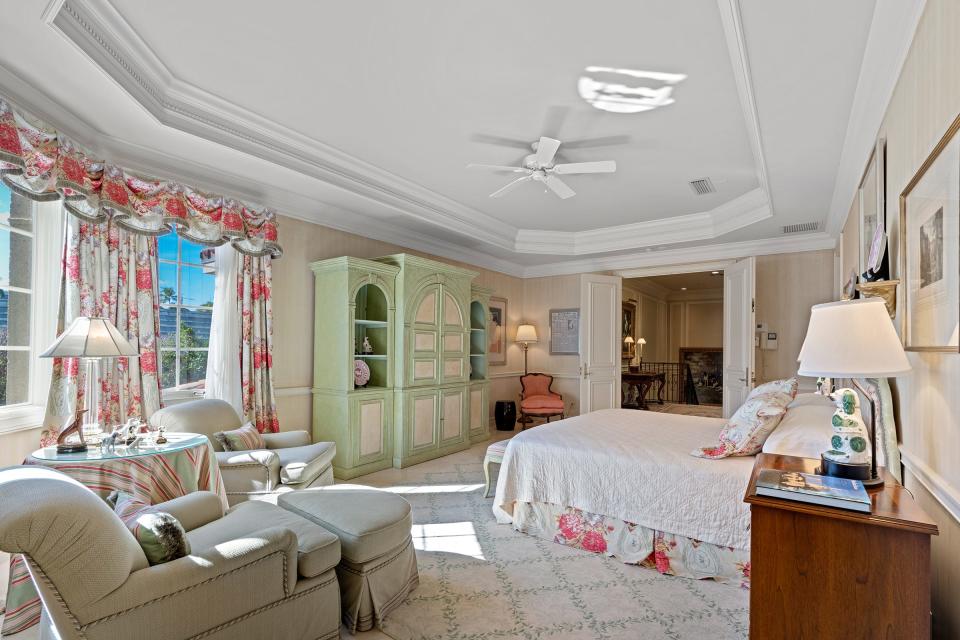 A bay window and a tray ceiling are features of the primary bedroom.