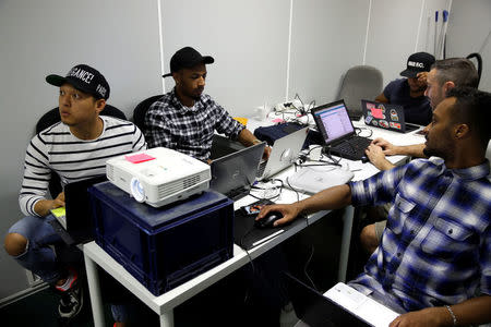 Student Nicky Hour, aged 25, works in his web development class as part of a professional training at the Simplon.co school specialized in digital sector in Montreuil, near Paris, France, June 14, 2018. Picture taken June 14, 2018. REUTERS/Philippe Wojazer