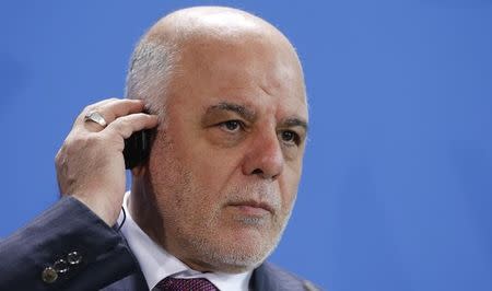 Iraq's Prime Minister Haidar al-Abadi listens to a translation during a news conference at the Chancellery in Berlin, Germany, February 11, 2016. REUTERS/Fabrizio Bensch