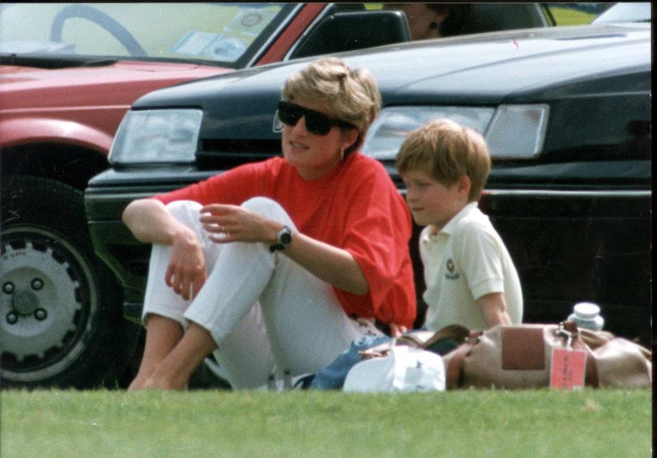 A young Prince Harry with his mother (Getty)