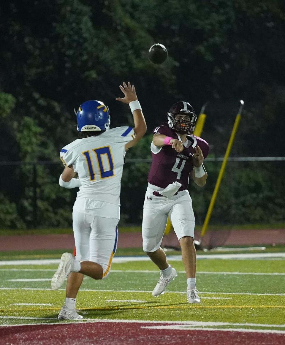Harrison quarterback Marco Citro (4) fires a pass during their 18-0 win over Mahopac in Class A quarterfinal football action at Harrison High School in Harrison on Friday, October 27, 2023.