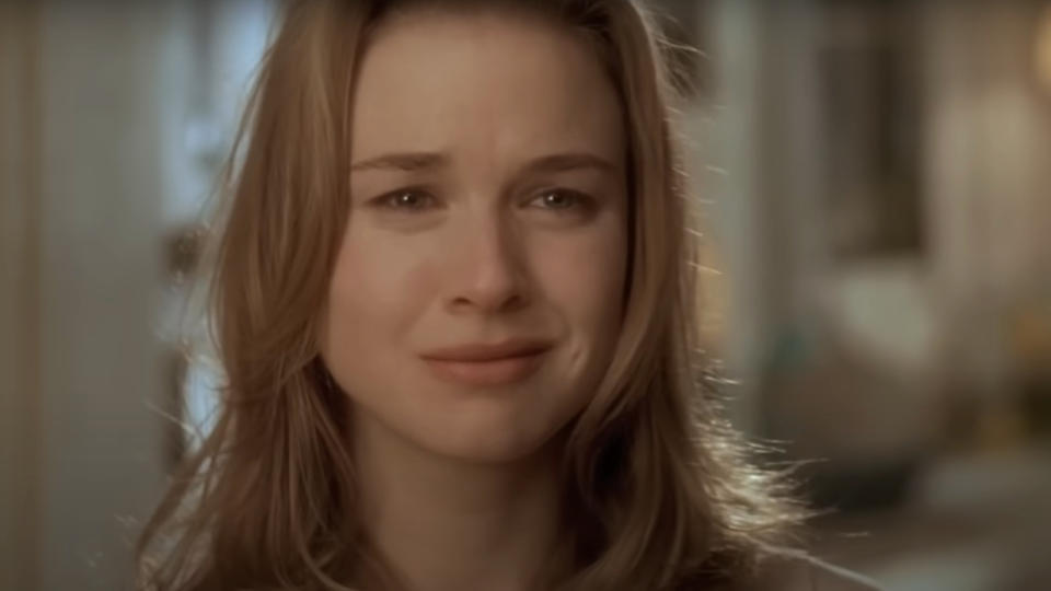 Renee Zellweger stands crying in her doorway in Jerry Maguire.