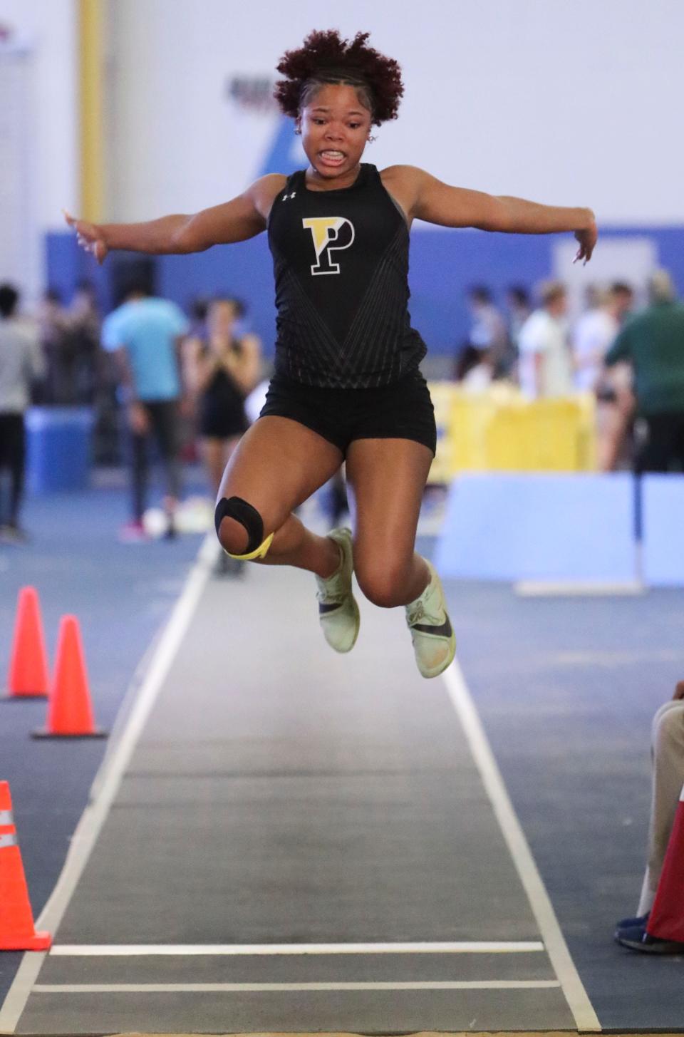 Mekiyah Earnest of Padua participates in the long jump after earlier winning the triple jump crown during the DIAA indoor track and field championships at the Prince George's Sports and Learning Complex in Landover, Md., Saturday, Feb. 3, 2024.
