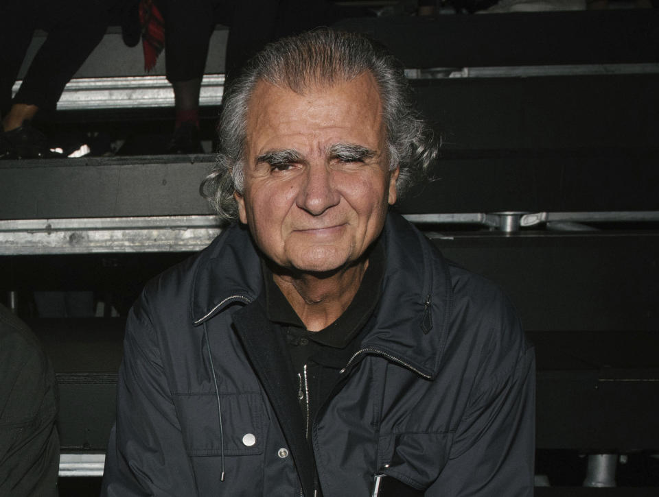 Patrick Demarchelier appears at the Saint Laurent Spring-Summer 2016 ready-to-wear fashion collection, presented during the Paris Fashion Week on Oct. 5, 2015. Demarchelier, the French-born photographer known for his high fashion images of top models and celebrities, including Princess Diana, has died at age 78. (AP Photo/Zacharie Scheurer, File)