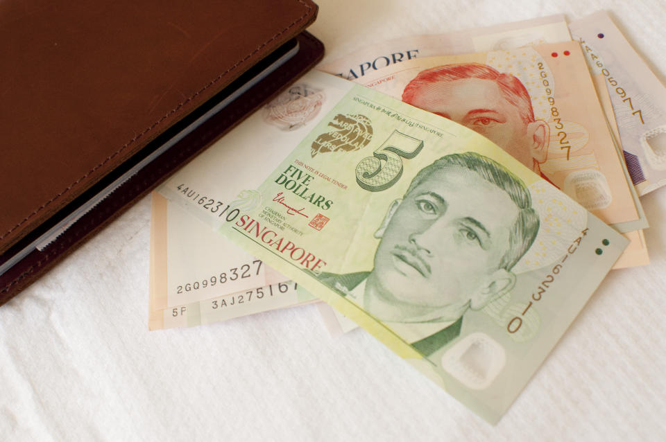 Singapore currency, illustrating a story on a guide to investing in Singapore Savings Bond.