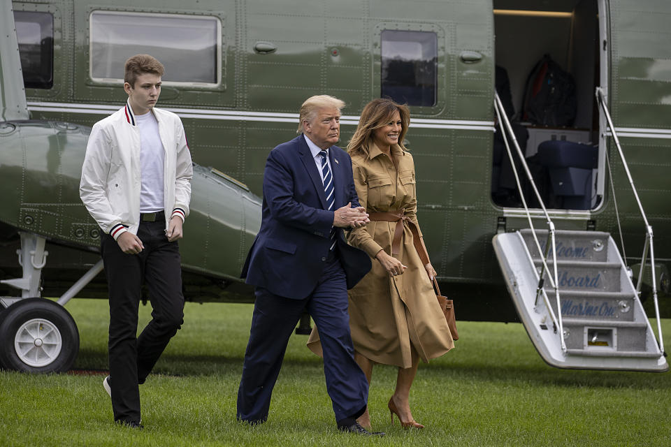 WASHINGTON, DC - AUGUST 16: Barron Trump, US President Donald Trump and First lady Melania Trump walk on the South Lawn of the White House on August 16, 2020 in Washington, DC. Robert Trump, 71, the younger brother of the president, died Saturday in Manhattan.  (Photo by Tasos Katopodis/Getty Images)