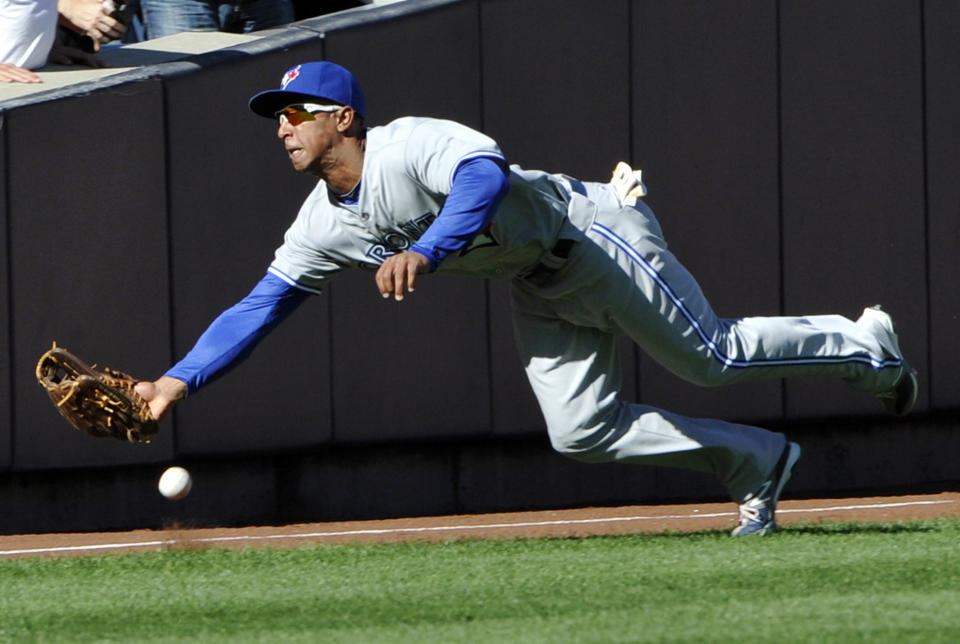 Toronto Blue Jays left fielder Anthony Gose cannot catch a double hit by New York Yankees' Ichiro Suzuki during the eighth inning of the first baseball game of a day-night doubleheader Wednesday, Sept. 19, 2012, at Yankee Stadium in New York. The Yankees defeated the Blue Jays 4-2. (AP Photo/Bill Kostroun)