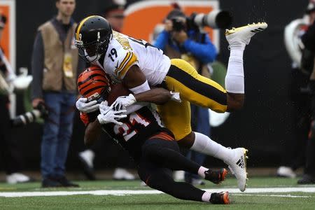 Oct 14, 2018; Cincinnati, OH, USA; Cincinnati Bengals defensive back Darqueze Dennard (21) defends against Pittsburgh Steelers wide receiver JuJu Smith-Schuster (19) in the first half at Paul Brown Stadium. Mandatory Credit: Aaron Doster-USA TODAY Sports