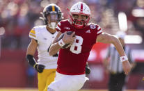 Nebraska quarterback Logan Smothers (8) rushes against Iowa during the first half of an NCAA college football game Friday, Nov. 26, 2021, at Memorial Stadium in Lincoln, Neb. (AP Photo/Rebecca S. Gratz)