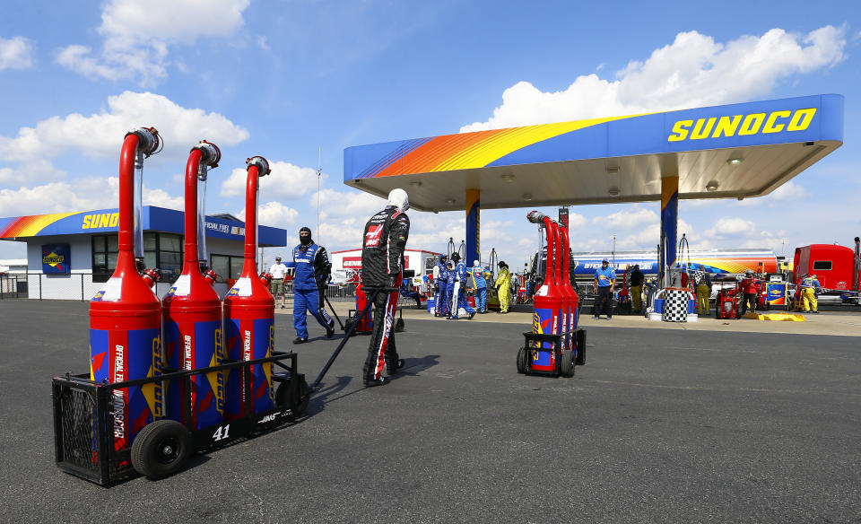 Crews head to the gas pumps to refill tanks during a NASCAR Cup Series auto race at Talladega Superspeedway, Sunday, April 28, 2019, in Talladega, Ala. (AP Photo/Butch Dill)