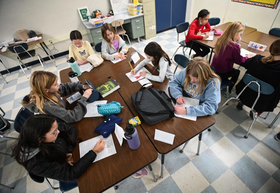 Hayes Intermediate School fifth- and sixth-graders write down some of the personal attributes they are most proud of Wednesday, Nov. 29, 2023, in Kathleen Mikulec's "Girl Empowerment"class. There are more than 30 unique enrichment classes students may choose from based on their personal interests.