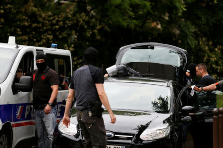 Investigators are seen during a police operation in Oullins, near Lyon, France May 27, 2019. REUTERS/Emmanuel Foudrot