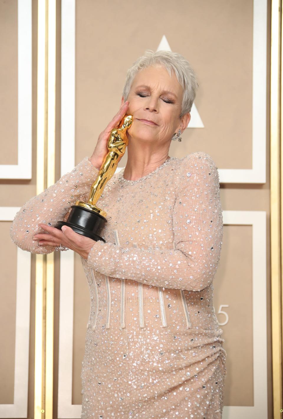 Jamie Lee Curtis begged not to be canceled on the same night as winning her first Oscar after she accidentally insulted a journalist from Hungary.