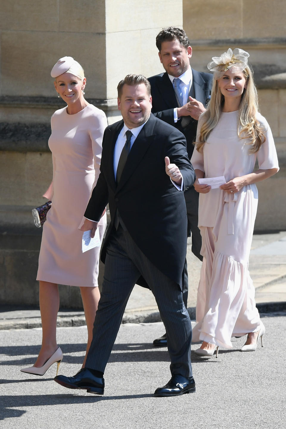 James Corden and his wife Julia Carey heading to the wedding ceremony. [Photo: Getty]