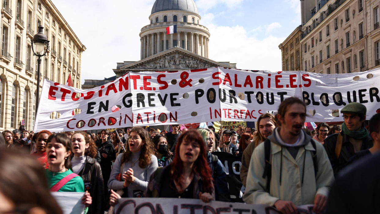 Parisians demonstrate on Thursday after the French government pushed pension reform through Parliament without a vote