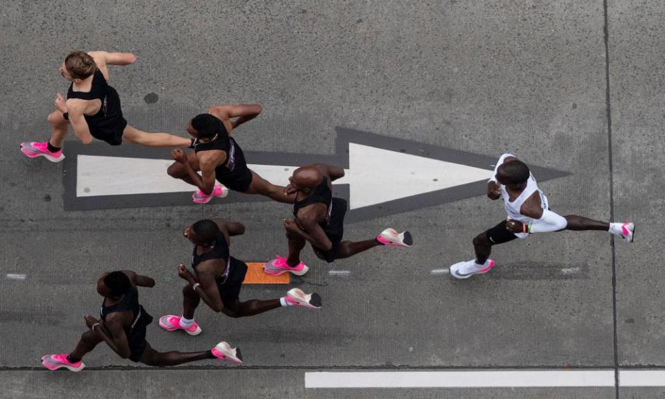 Eliud Kipchoge (right) runs the first sub two-hour marathon, Vienna, October 2019.