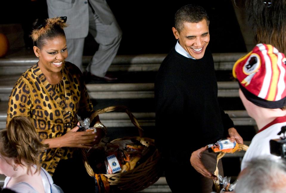 Barack and Michelle Obama on Halloween. Michelle Obama is dressed up as a leopard.