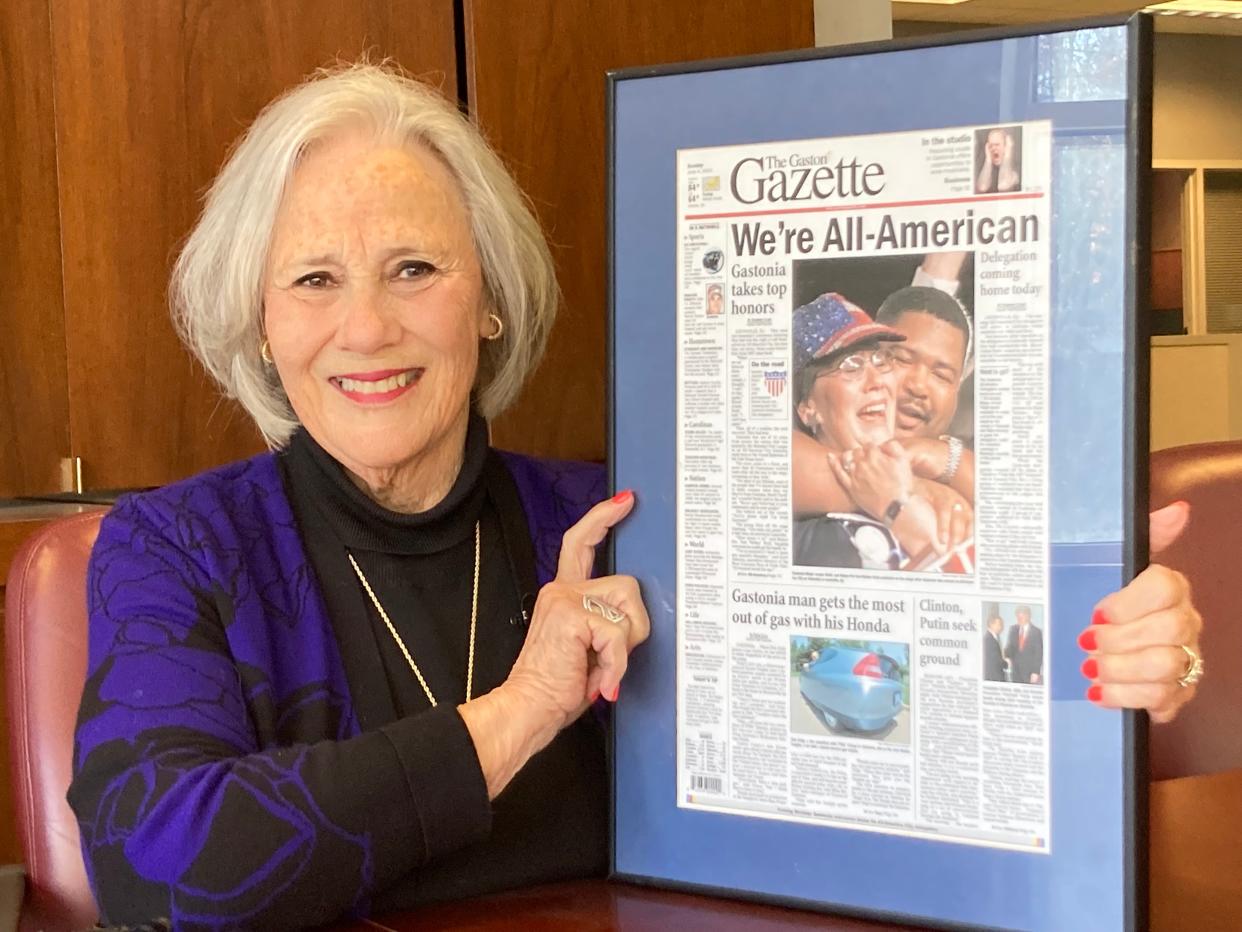 Former Gastonia Mayor Jennie Stultz holds a widely shared newspaper photo featuring Stultz and Mayor Walker Reid, who served on the Gastonia City Council while Stultz was mayor.