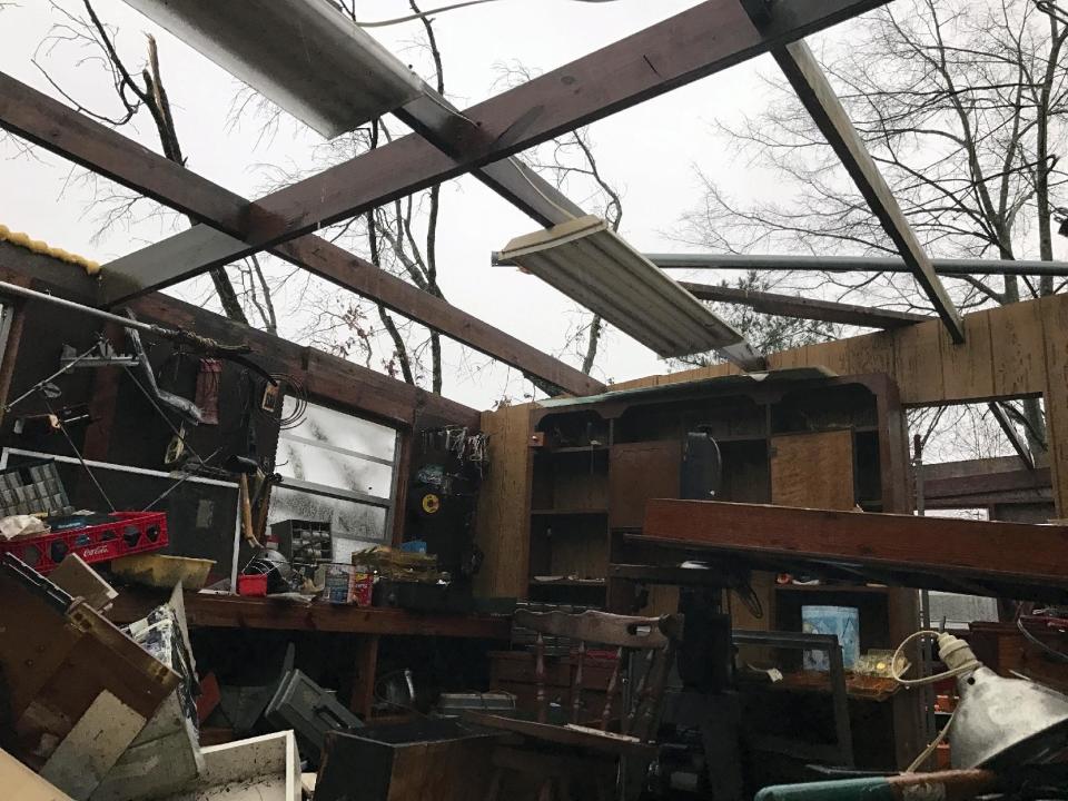 Items lie scattered about after a storm south of Mount Olive, Miss., took of the roof Monday, Jan. 2, 2017. Forecasters say damaging winds, hail and flash flooding will be possible on Monday as a storm system moves across the South. (Ryan Moore/WDAM-TV via AP)