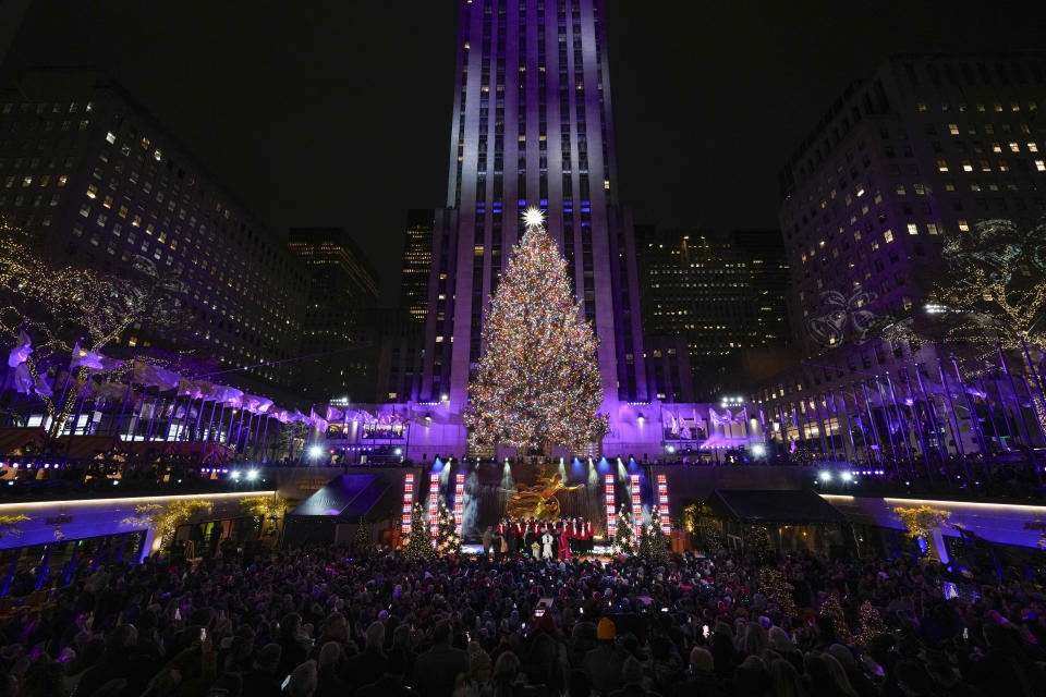 The Christmas tree at Rockefeller Center is lit in New York, Wednesday, Nov. 29, 2023. (AP Photo/Seth Wenig)