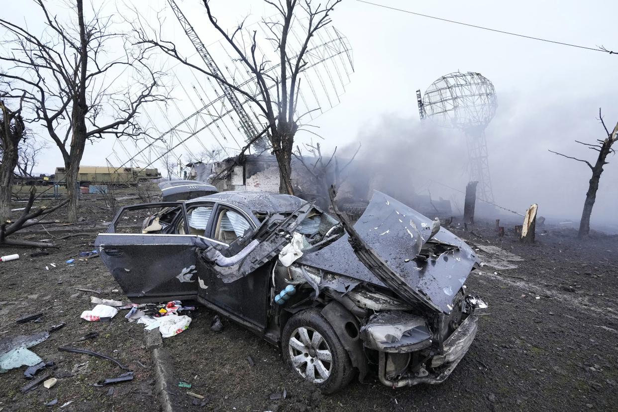 Damaged radar, a vehicle and equipment are seen at a Ukrainian military facility outside Mariupol, Ukraine, Thursday, Feb. 24, 2022.