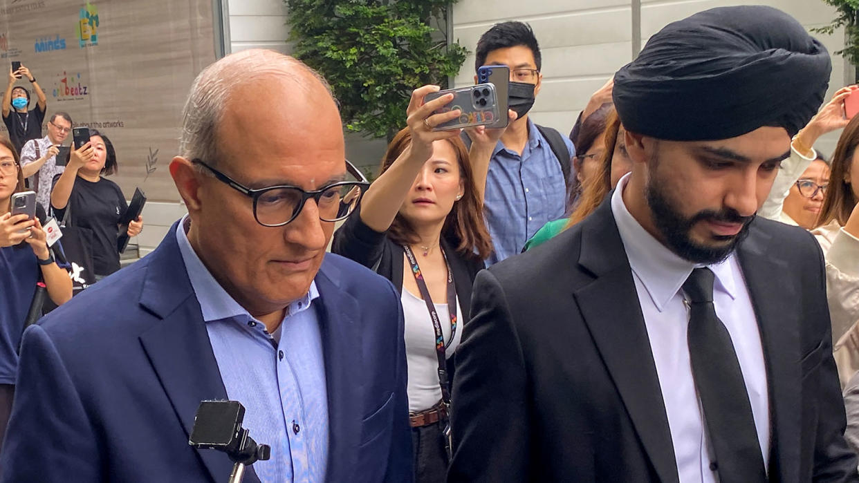 S. Iswaran (left) leaves the State Court in Singapore on 18 January 18, 2024. He was discharged from hospital a day after his extension to remain outside of Singapore was granted by the courts. (Photo: CATHERINE LAI / AFP)