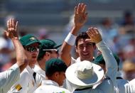 Cricket - Australia v South Africa - First Test cricket match - WACA Ground, Perth, Australia - 3/11/16 - Australia's Mitchell Starc celebrates with team mates after dismissing South Africa's captain Faf du Plessis at the WACA Ground in Perth. REUTERS/David Gray