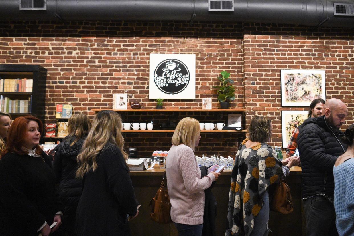 Fans stand in line to have their book signed at author Audra McElyea’s book launch at Addison’s Bookstore on Gay Street, Friday, Jan. 5, 2024.