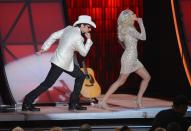 NASHVILLE, TN - NOVEMBER 01: (L-R) Co-hosts Brad Paisley and Carrie Underwood present during the 46th annual CMA Awards at the Bridgestone Arena on November 1, 2012 in Nashville, Tennessee. (Photo by Jason Kempin/Getty Images)