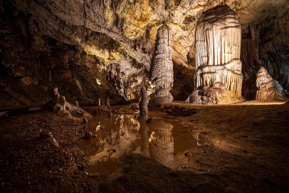 This photograph taken on May 25, 2021, shows stalagmites, stalactites and other cave formations in a part of the Postojna Cave in Postojna.