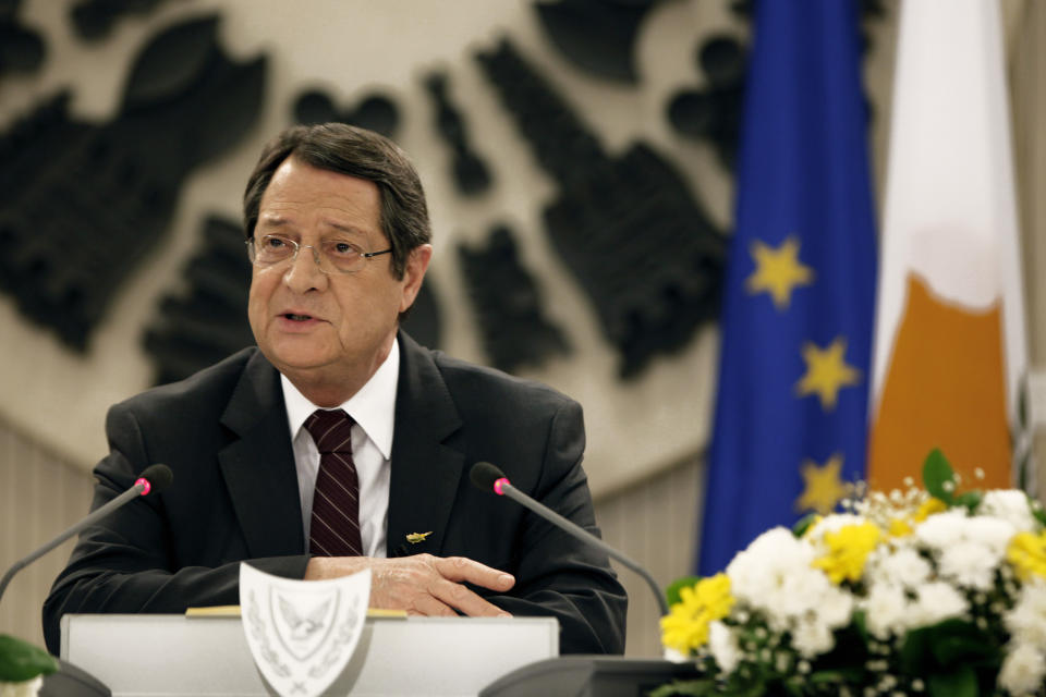 Cyprus President Nicos Anastasiades speaks during a nationally televised news conference at the Presidential Palace in Nicosia, Cyprus, Wednesday, Feb. 12, 2014. Anastasiades held the conference to defend a document he agreed with Turkish Cypriot leader Dervis Eroglu that paved the way for the resumption of negotiations a day earlier aimed at reunifying the war-divided island. Anastasiades faces strong pressure from critics who argue that the document contains the seeds of possible Turkish Cypriot statehood, which could unravel any peace accord. (AP Photo/Petros Karadjias)