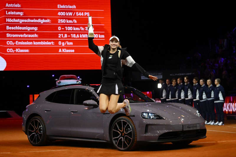 Kazakhstani tennis player Elena Rybakina celebrates with the trophy during the award ceremony after defeating Ukraine's Marta Kostyuk during their Women's singles final tennis match at the Stuttgart Open Tennis tournament. Marijan Murat/dpa