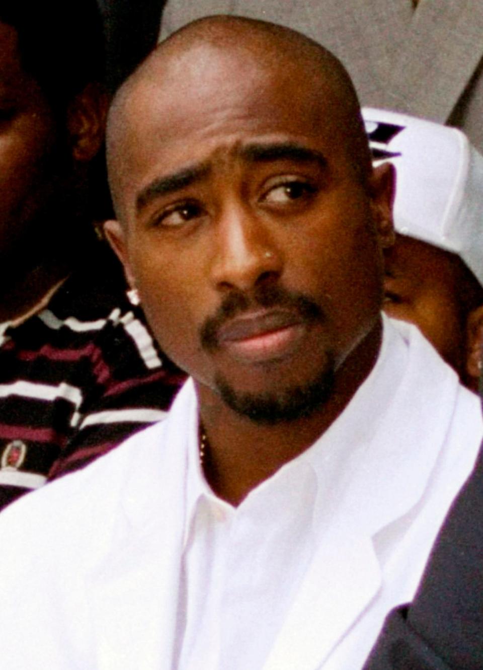 A grand jury in Las Vegas has indicted one of the last living witnesses to the 1996 killing of Tupac Shakur, seen here attending a voter registration event in South Central Los Angeles on Aug. 15, 1996. Duane "Keffe D" Davis has been charged Friday with murder with use a deadly weapon.