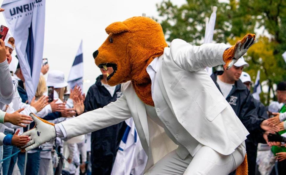 The Nittany Lion pumps ups fans for the football team to arrive at Beaver Stadium on Saturday, Sept. 23, 2023.